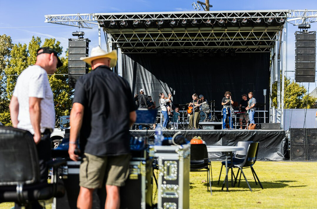 Event stage with technical crew equipment and screens